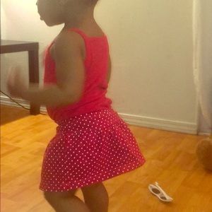 Red and white polka dot skort & red tank bodysuit